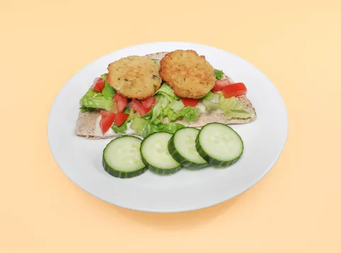 Falafel wrap with cucumber on the side